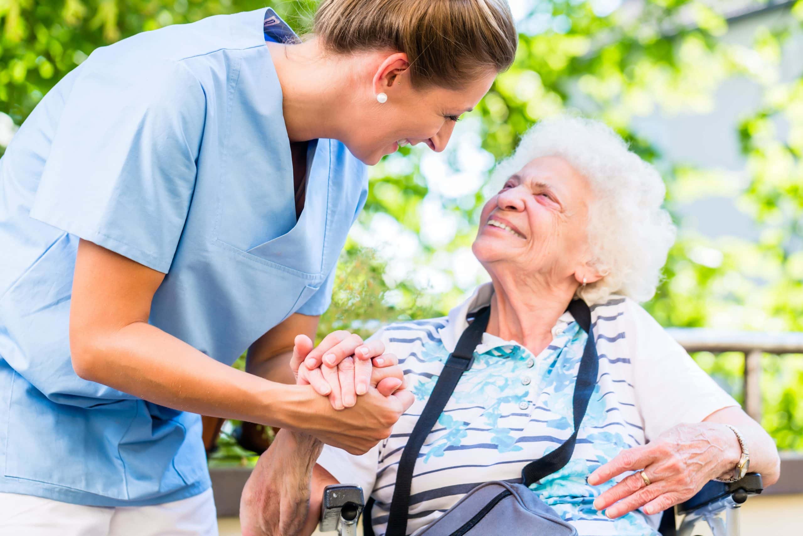 Woman Helping Elderly Lady