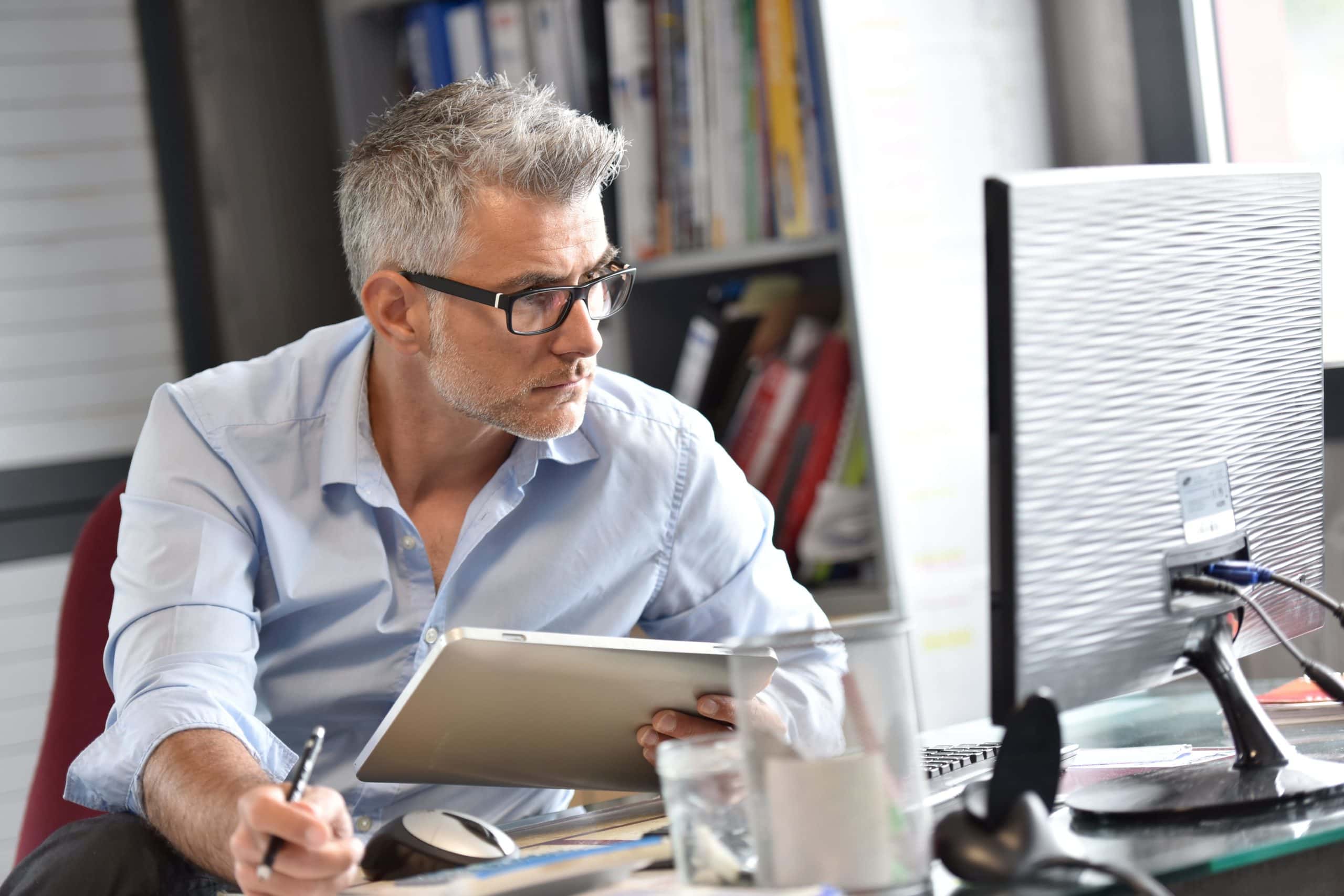 Middle Aged Man Starting Business On Computer