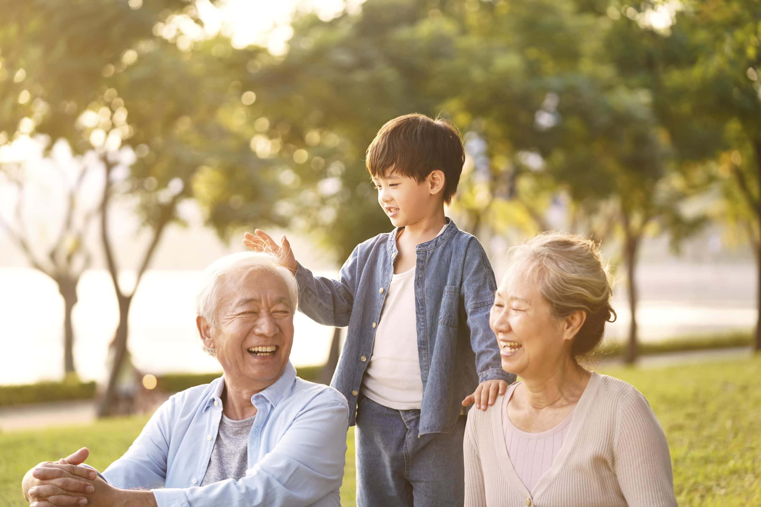 Asian Grandparents Playing With Their Grandson